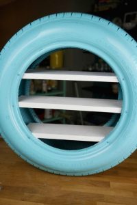 https://spaceshipsandlaserbeams.com/blog/party-crafts-and-diy/diy-toy-shelves-from-a-used-tire